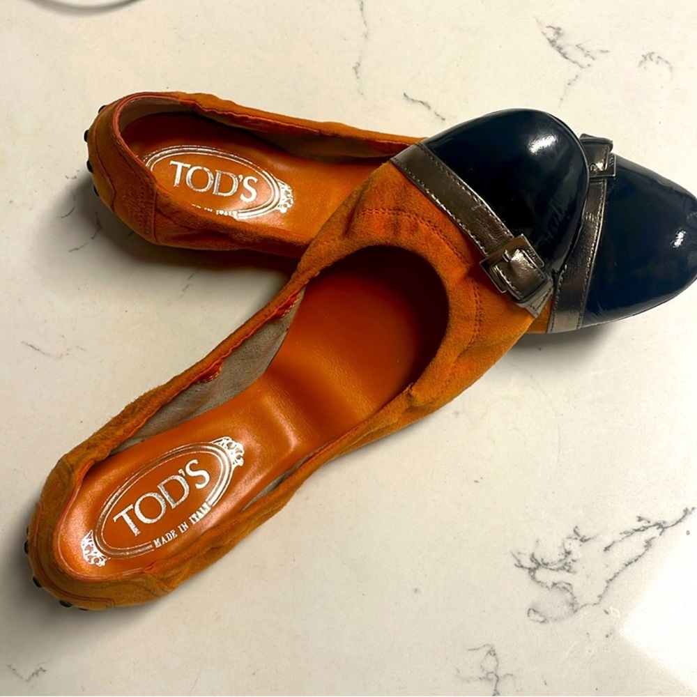 TOD’s orange suede with black cap toe flats size 9
